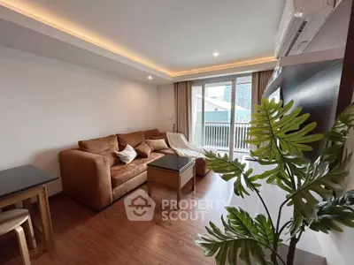 Modern living room with cozy sofa and balcony view in stylish apartment