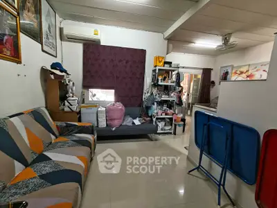 Cozy living room with modern decor and ample storage space, perfect for comfortable living.