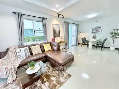 Spacious modern living room with elegant decor and dining area