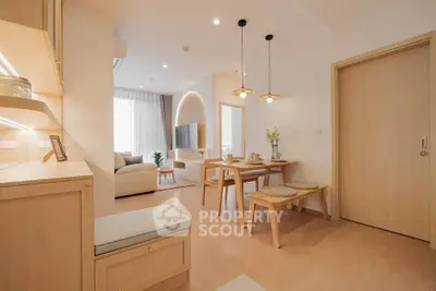 Modern open-plan living and dining area with stylish decor and natural light.
