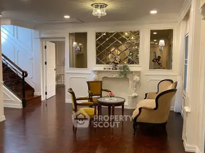 Elegant living room with classic furniture and wooden flooring