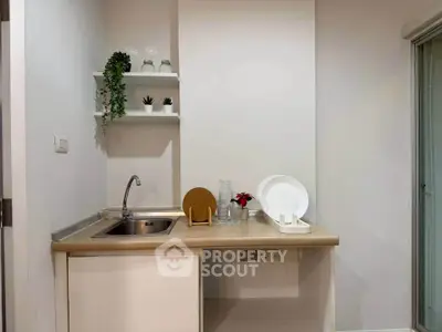 Modern compact kitchen with sleek countertop and open shelving