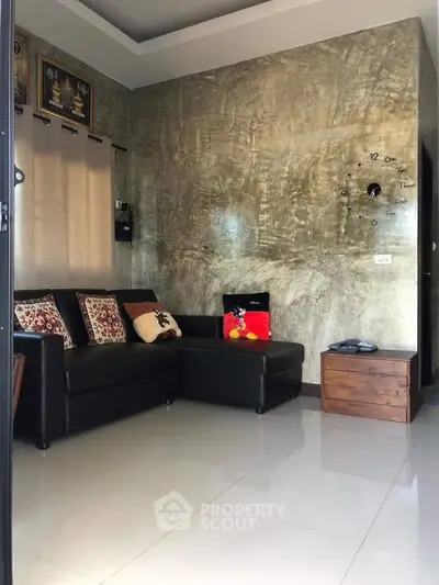 Stylish living room with modern decor and comfortable seating in a contemporary home.