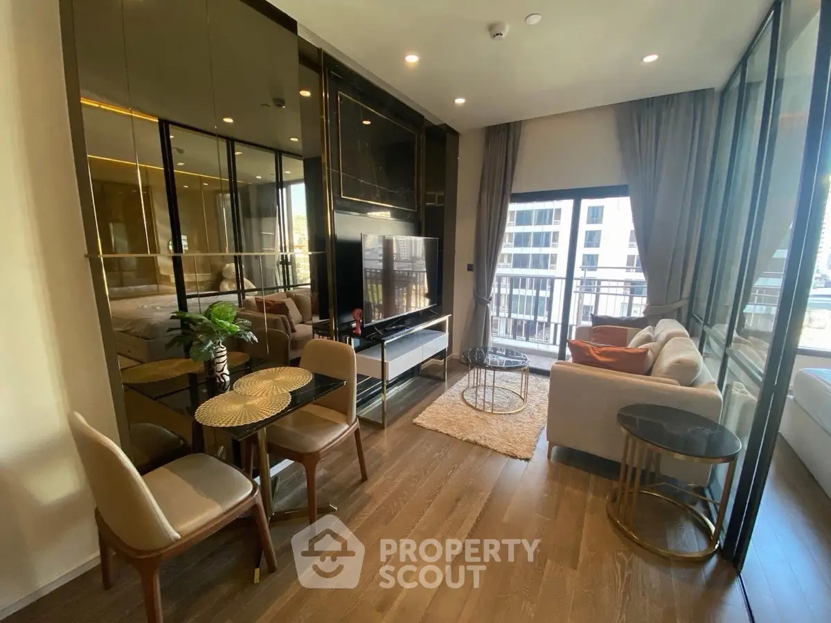 Modern living room with elegant decor and city view balcony in luxury apartment.