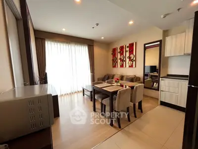 Modern living room with dining area and stylish decor in a cozy apartment