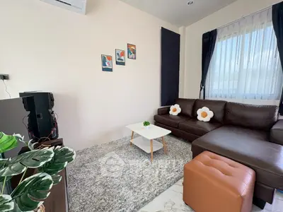 Charming living room with cozy brown sofa and modern decor