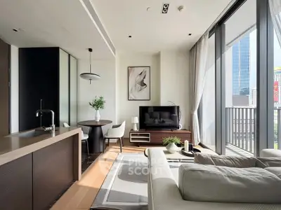 Modern living room with open kitchen and city view balcony in luxury apartment