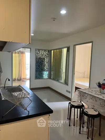 Charming apartment interior with modern kitchen and cozy dining area