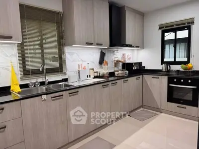 Modern kitchen with sleek cabinetry and built-in appliances