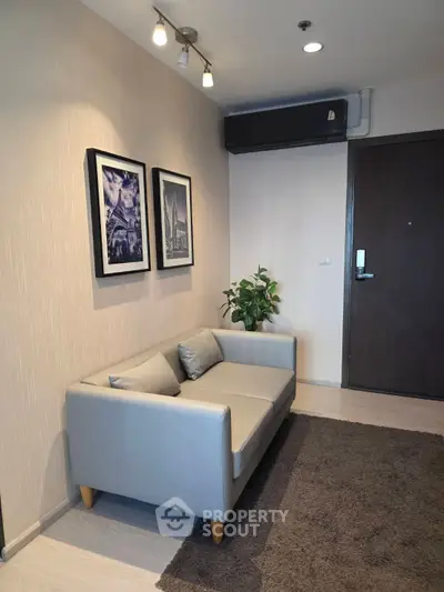 Modern living room with stylish sofa and wall art in a cozy apartment