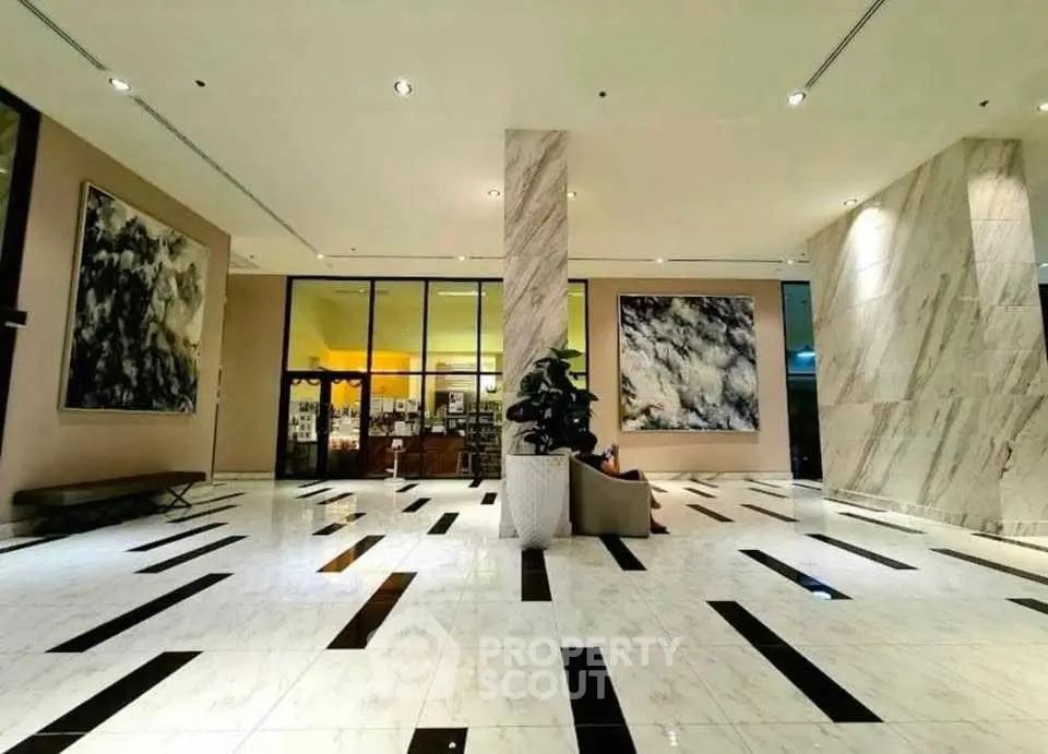 Luxurious building lobby with modern art and marble flooring