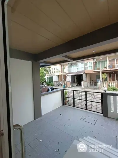 Charming townhouse entrance with covered porch and modern design