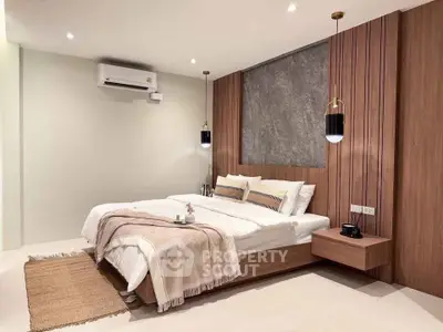Modern bedroom with stylish wood paneling and cozy lighting
