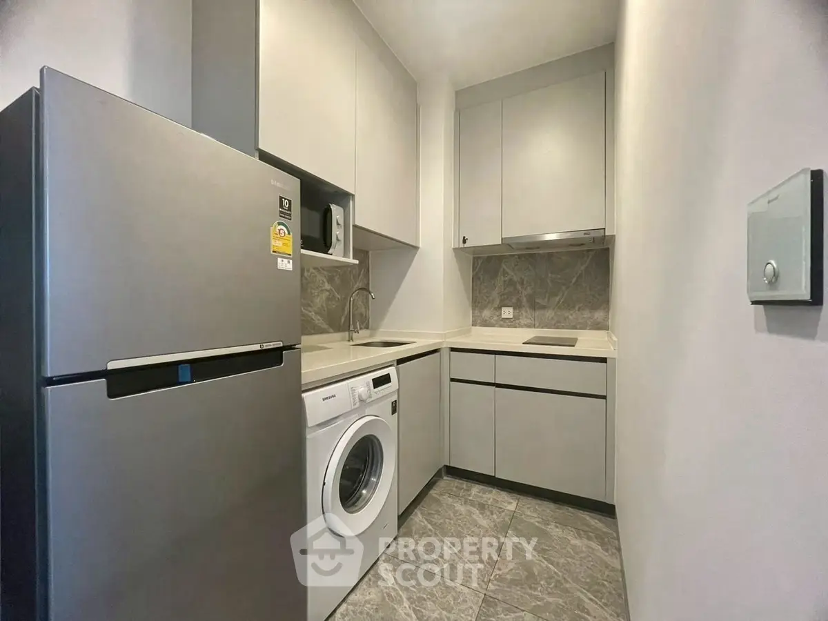 Modern compact kitchen with sleek appliances and efficient layout