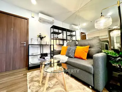 Modern living room with stylish decor and cozy seating area.