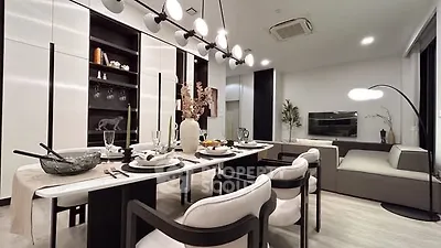 Modern dining and living room with elegant decor and stylish lighting