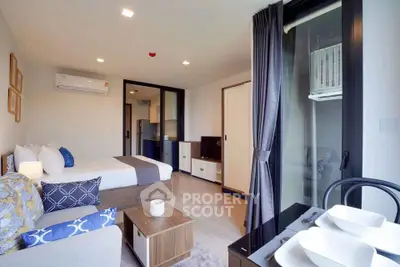 Modern studio apartment with cozy living area and stylish decor