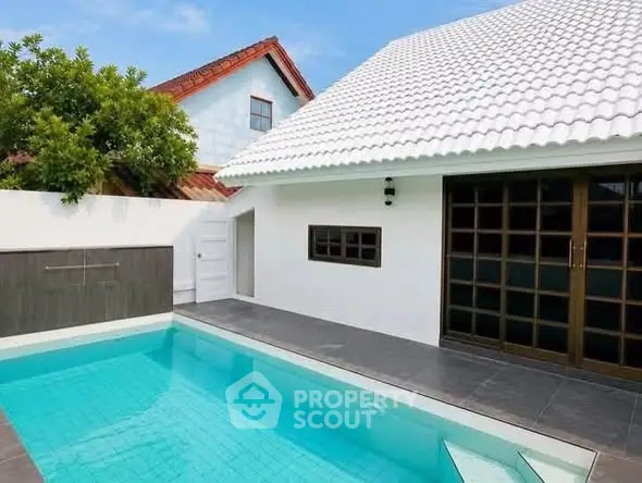 Charming home with a pristine private pool and modern architecture, perfect for relaxation and entertaining.