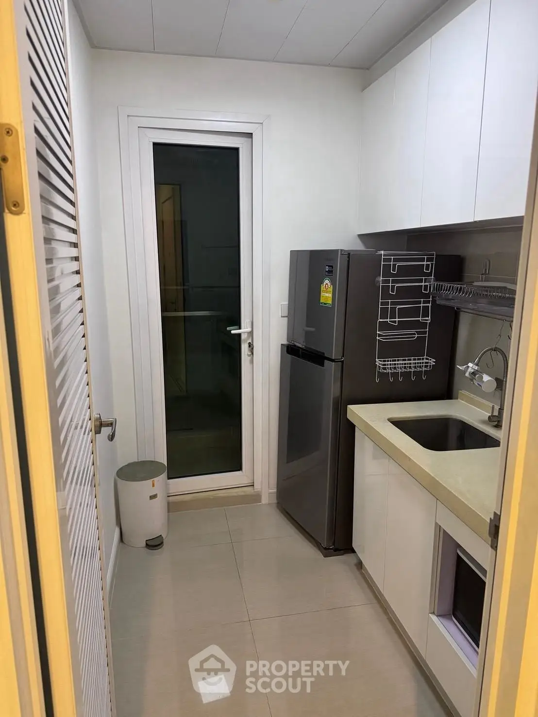 Modern compact kitchen with sleek appliances and efficient layout