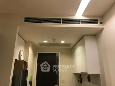 Modern kitchen with sleek cabinetry and integrated lighting