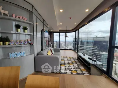 Stunning modern living room with panoramic city views and stylish decor in a high-rise apartment.