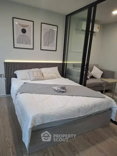 Modern bedroom with stylish decor and cozy seating area
