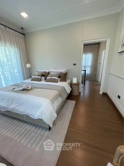 Luxurious bedroom with elegant decor and natural light