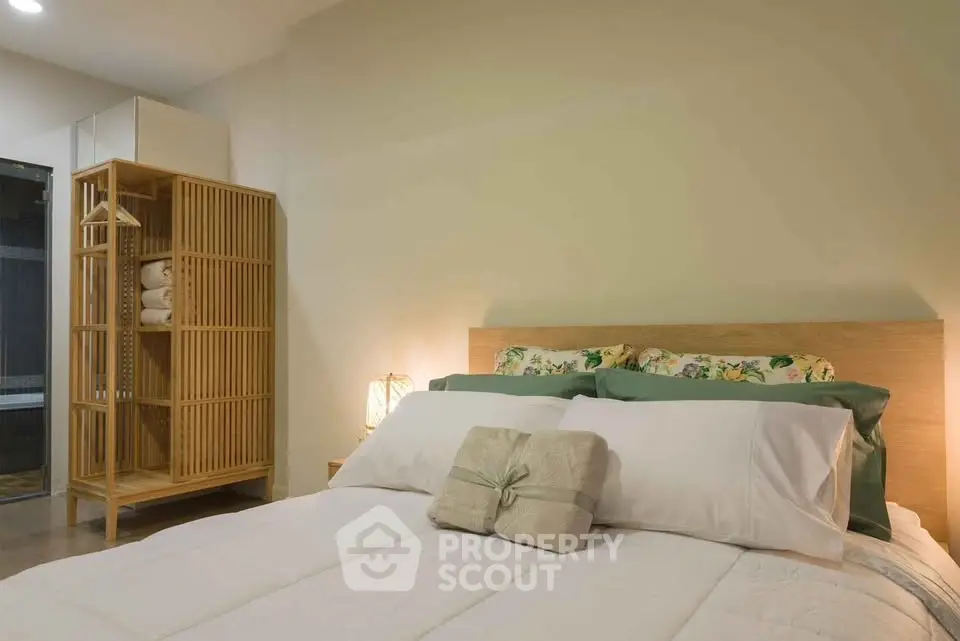 Cozy bedroom with modern wooden furniture and soft lighting