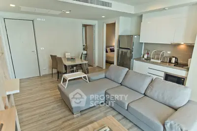 Modern open-plan living room with kitchen in stylish apartment