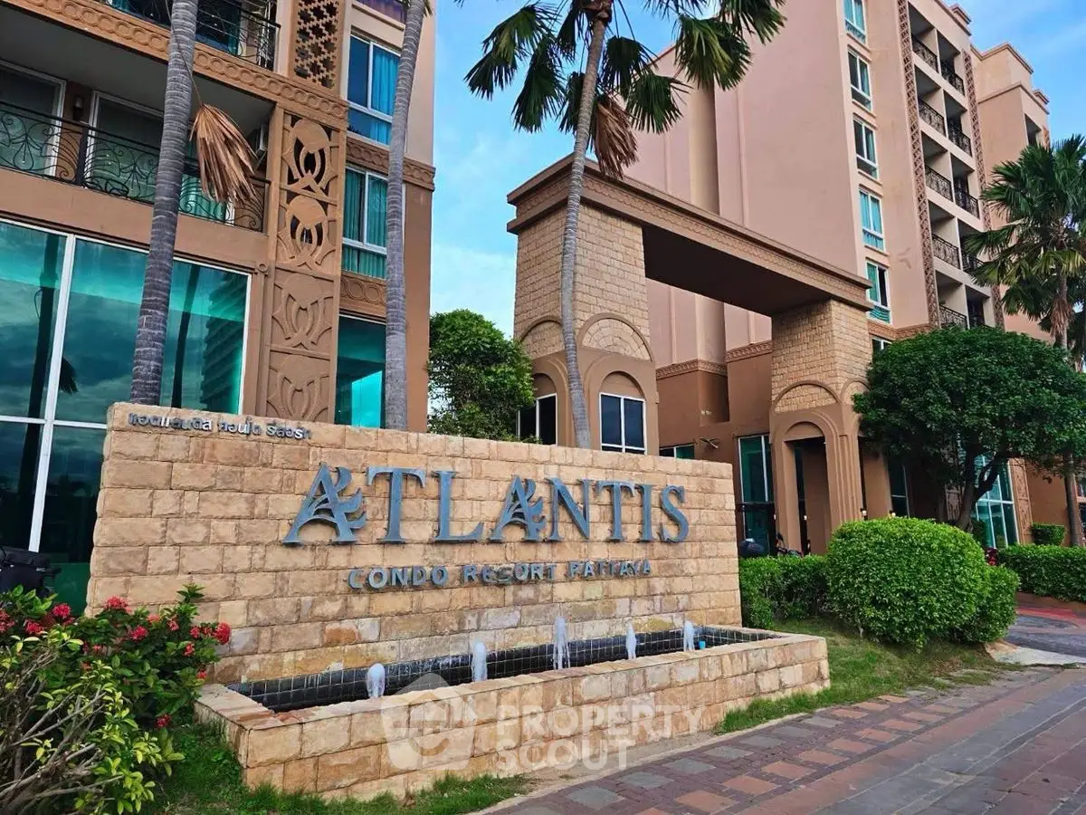 Stunning Atlantis Condo Resort entrance with lush landscaping and modern architecture.