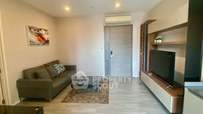 Modern living room with sleek furniture and stylish decor in a contemporary apartment.
