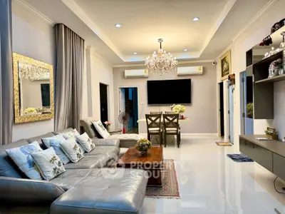 Luxurious living room with elegant chandelier and modern decor