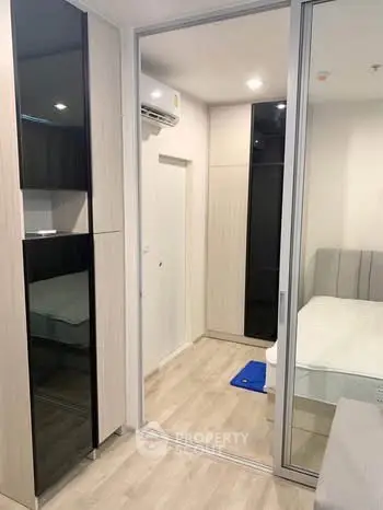 Modern bedroom with mirrored closet and sleek design
