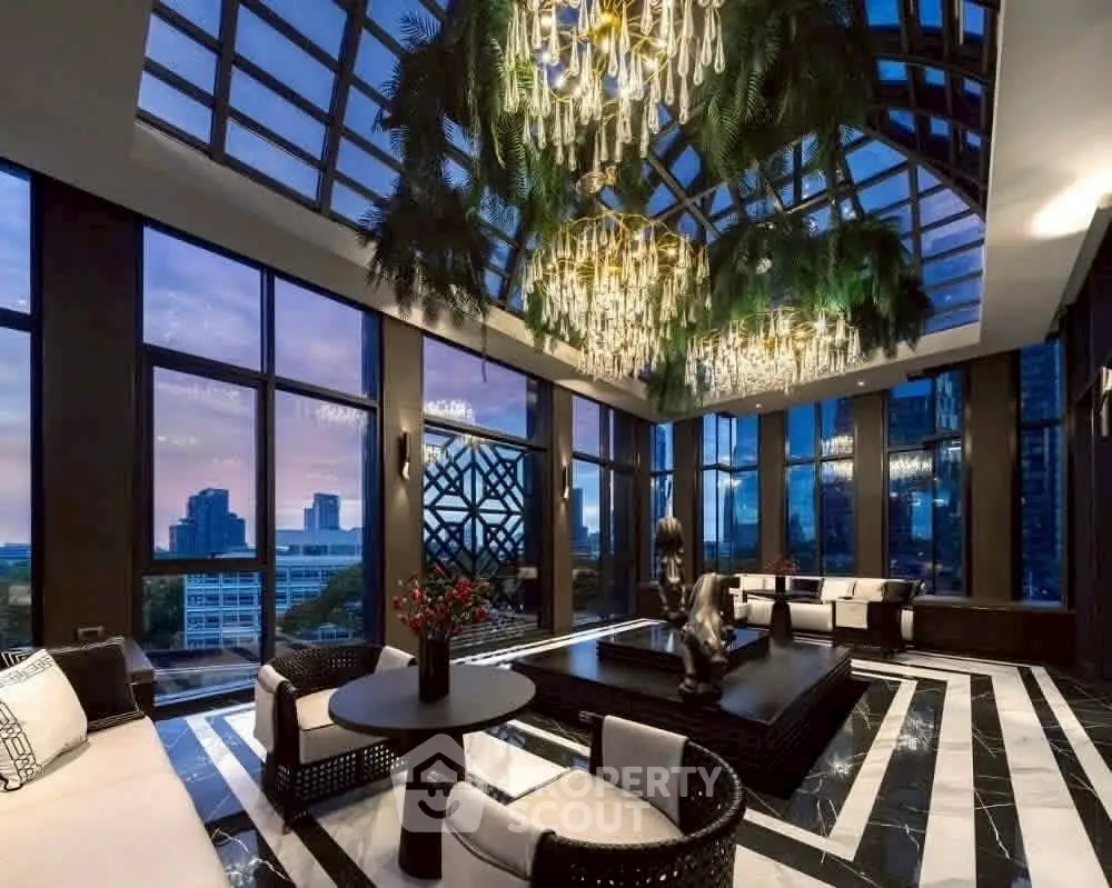Luxurious living room with stunning city view and elegant chandelier lighting.