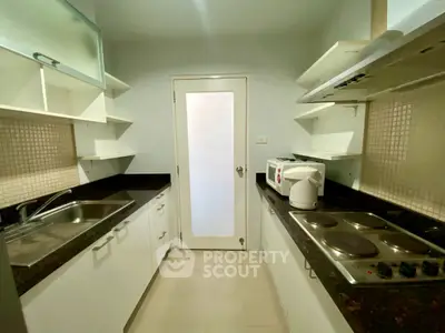 Modern kitchen with sleek countertops and ample storage space