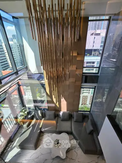 Luxurious high-rise living room with floor-to-ceiling windows and stunning city views.