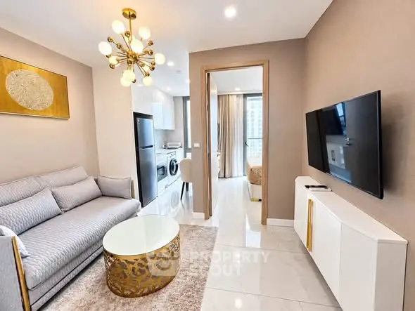 Modern living room with elegant decor and open kitchen layout