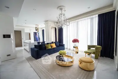 Luxurious living room with elegant decor and modern furniture, featuring a spacious open layout and large windows.