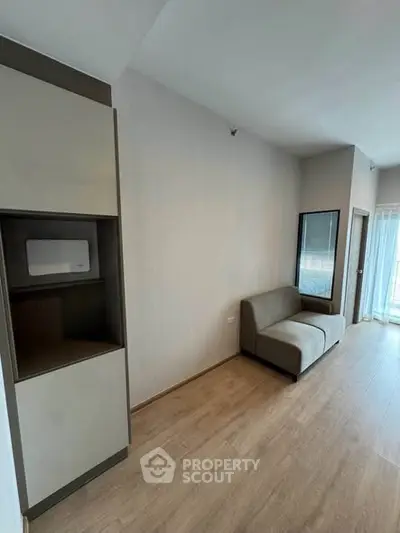 Modern living room with sleek furniture and natural light, perfect for urban living.