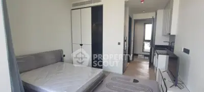 Modern bedroom with sleek design and built-in wardrobe in a contemporary apartment.