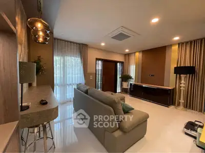 Luxurious modern living room with elegant decor and ample natural light