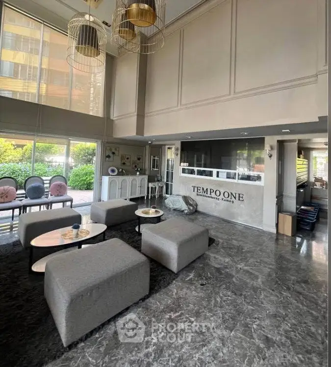 Luxurious modern lobby with high ceilings and elegant decor at Tempo One residence.