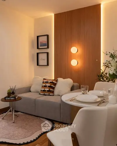 Cozy modern living room with stylish decor and dining area, perfect for urban living.