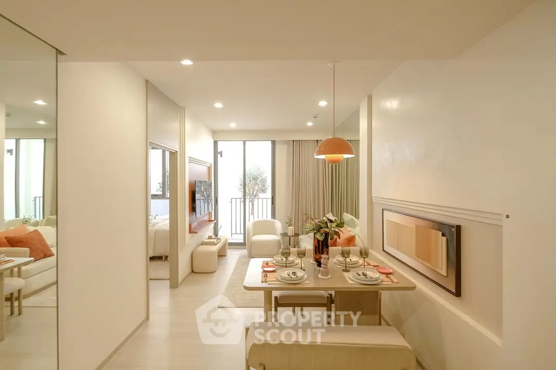 Modern open-plan living and dining area with elegant decor and natural light.