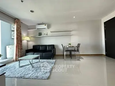 Spacious modern living room with sleek furniture and natural light