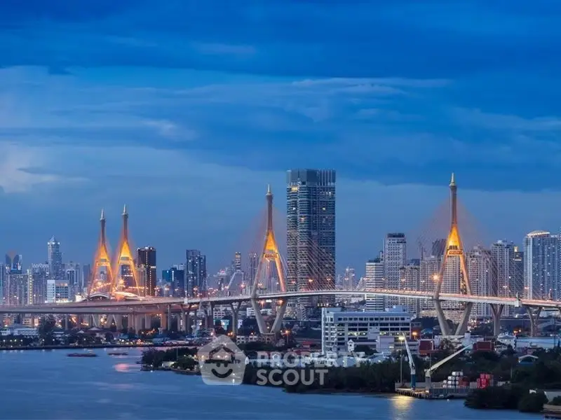 Stunning cityscape view with illuminated bridge and skyline at dusk, perfect for urban living enthusiasts.