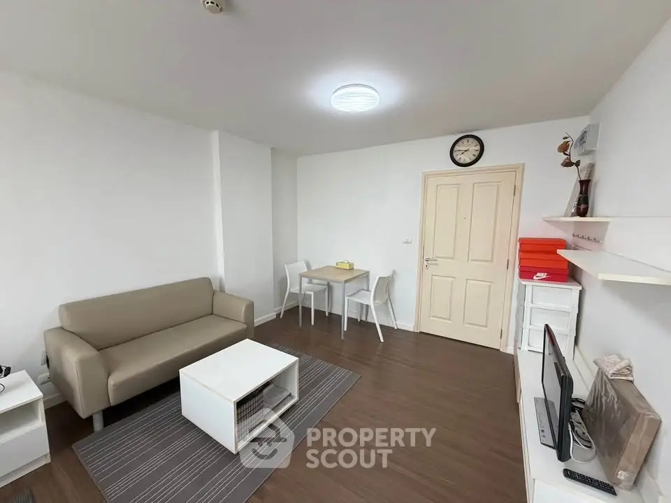 Modern living room with sleek furniture and stylish decor in a cozy apartment.