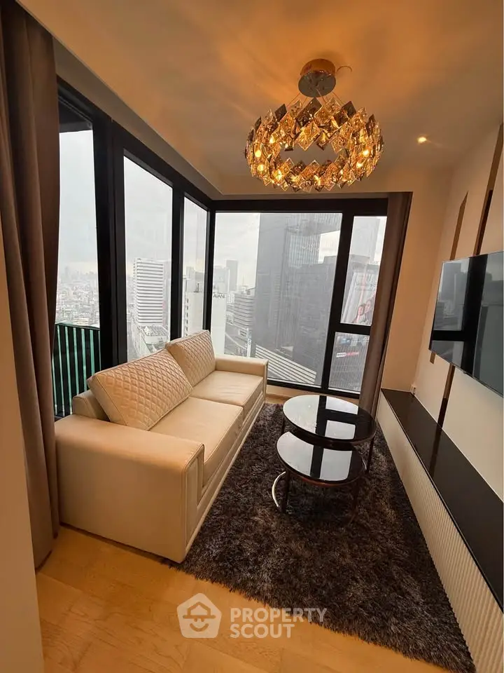 Luxurious corner unit living room with stunning city view and elegant chandelier.