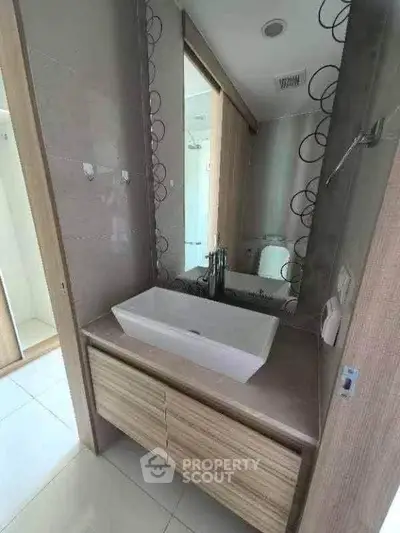 Modern bathroom with stylish sink and mirror in a contemporary home.