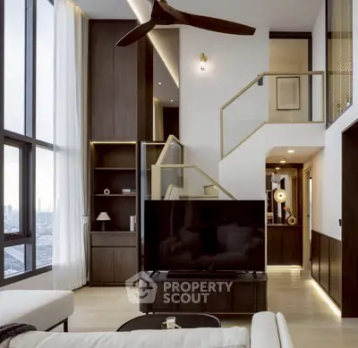 Luxurious modern living room with high ceilings and city view, featuring elegant decor and natural light.